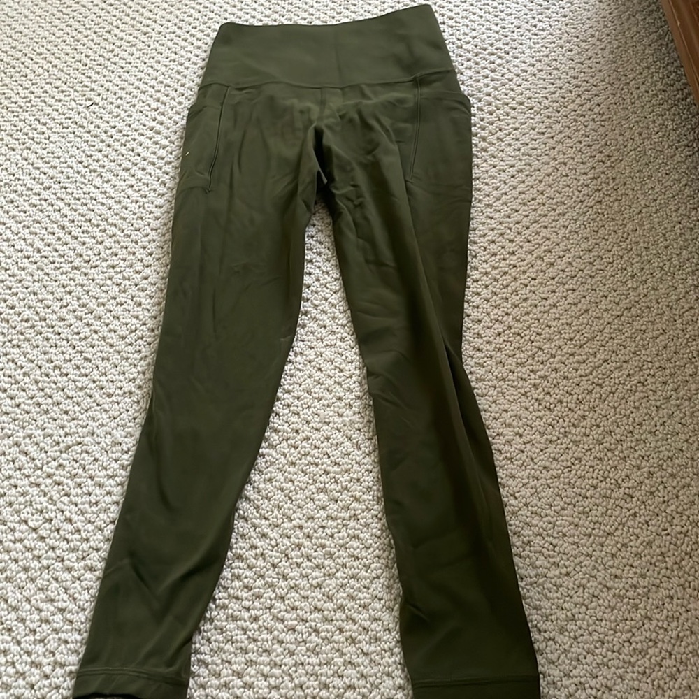 Salutation stash pocket 11 7/8 tight green leggings